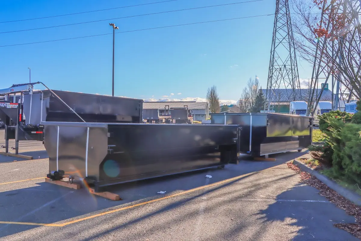 Roll-off dumpster ready for waste disposal at job site for 2 Yard Dumpster Rental in St. John